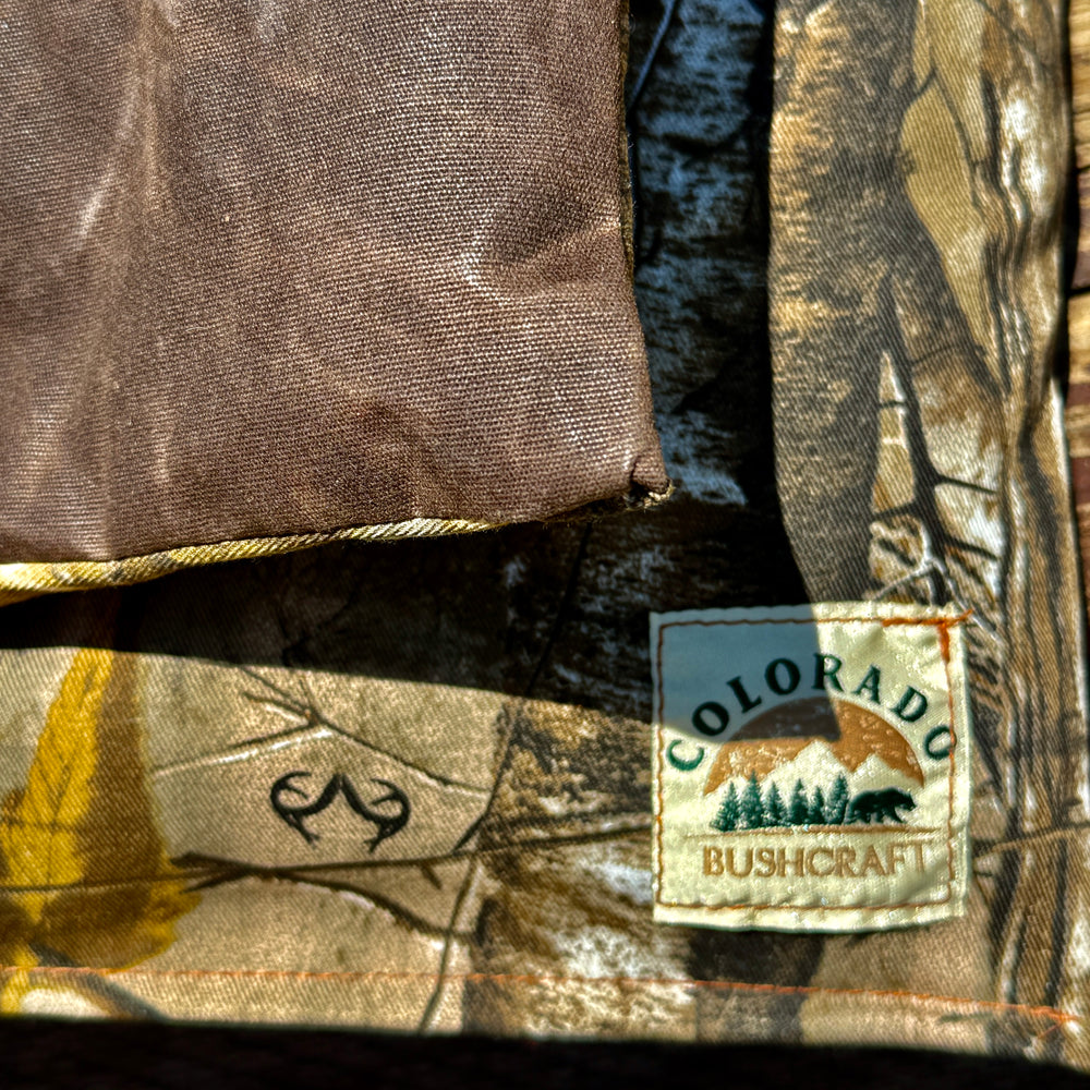 Realtree Bushcraft Cooshun - Waxed Canvas, Woodland Camo Cordura, and Wool Sitting Pad